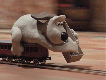 An animated gif of Gromit laying down the tracks ahead of a moving train